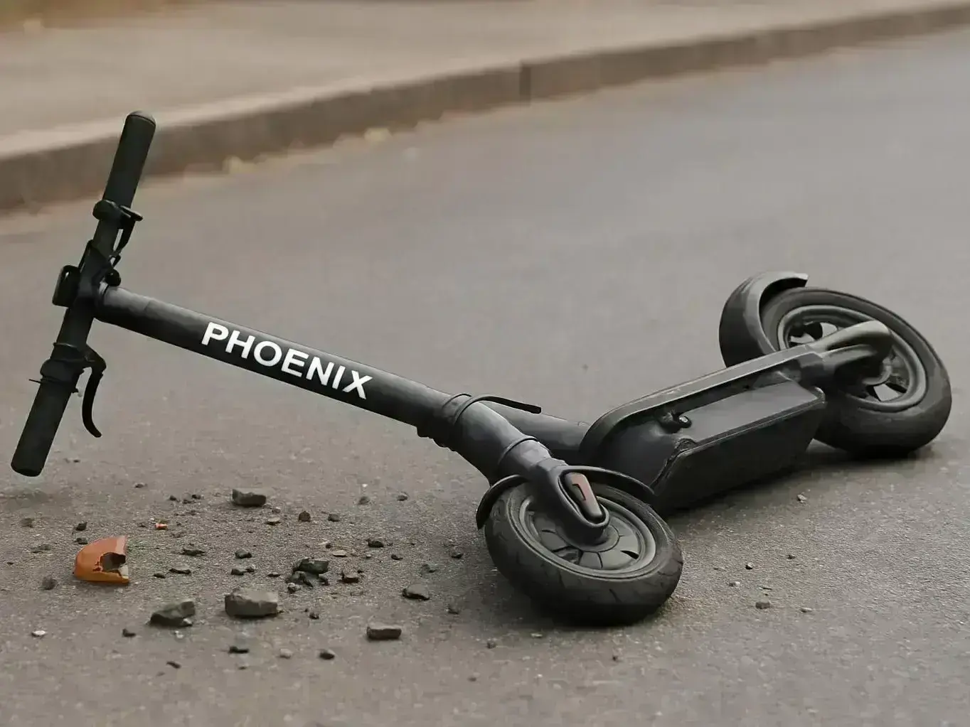 Injured e-scooter rider meeting with Phoenix personal injury attorney after collision near Camelback Road